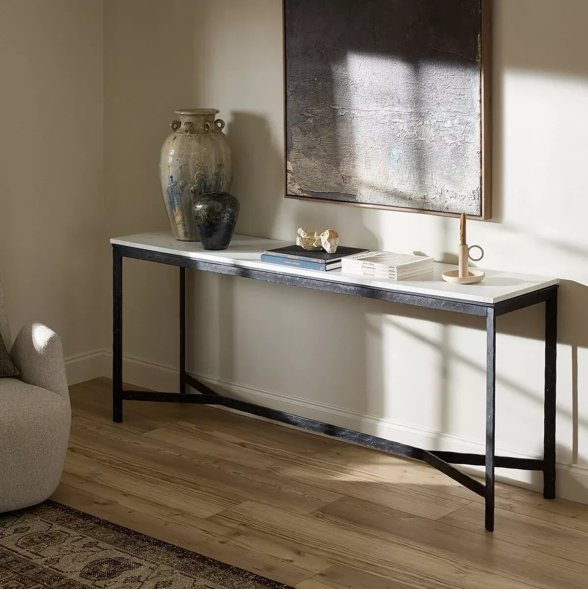 Four Hands Hammered Iron Console Table in White Marble